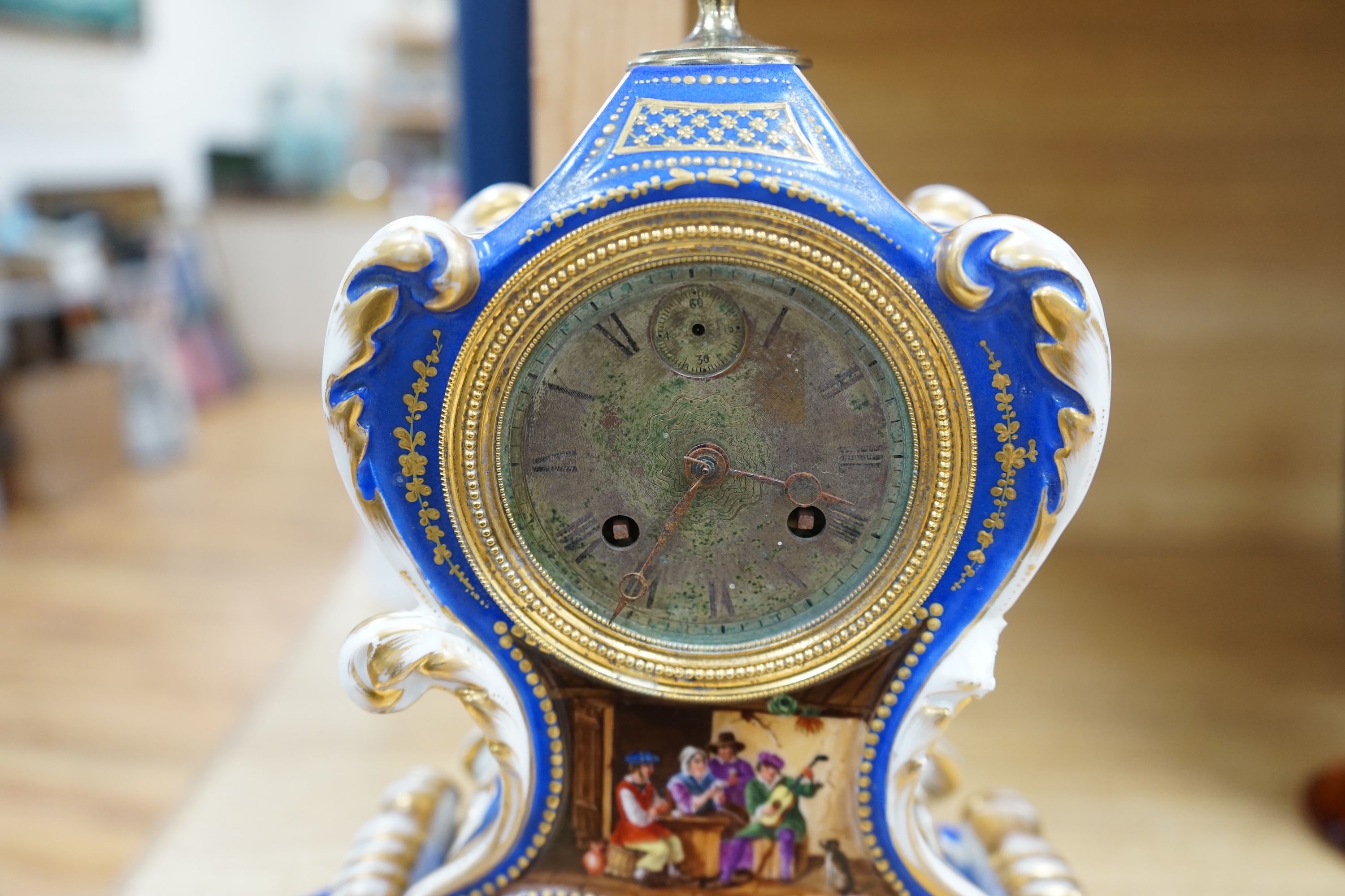 A French Paris porcelain waisted clock, striking on a bell, raised on original matching stand in the style of Jacob Petit c.1830, 37cm high. Condition - poor to fair